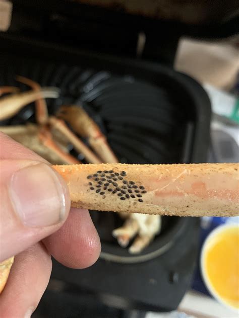 black dots on crab legs|black parasite eggs crab legs.